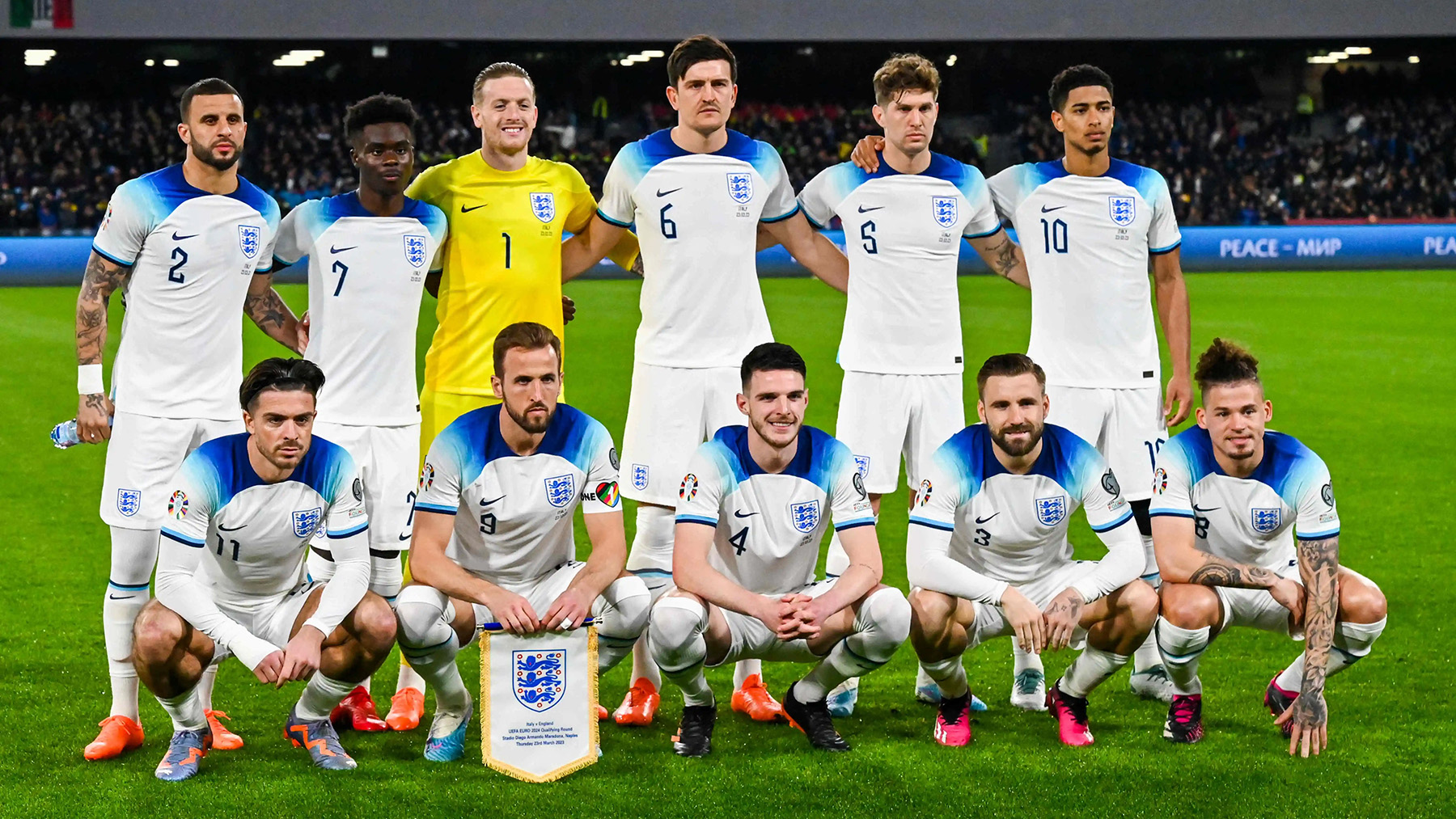  The image shows the England soccer team posing for a photo before their Euro 2024 qualifying match against Italy.